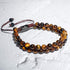 Zweireihiges Armband aus gelbem Tigerauge – edle Natursteinperlen auf weißem Hintergrund, 6 mm Kugeln, Premium-Makramee-Verschluss von UNIQAL